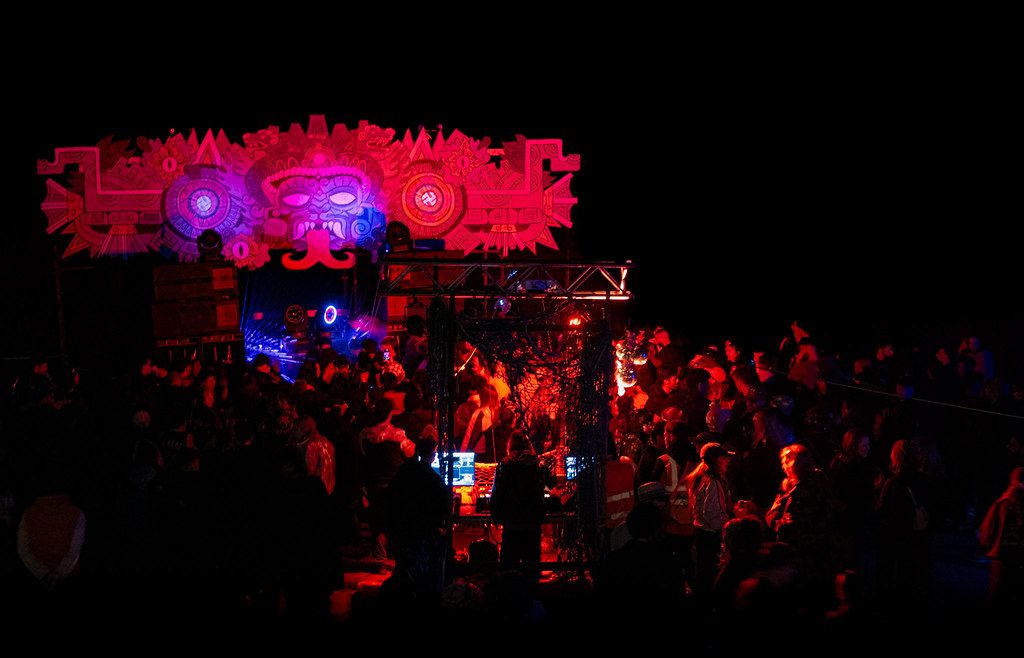 Festival stage production at night with full lighting rig