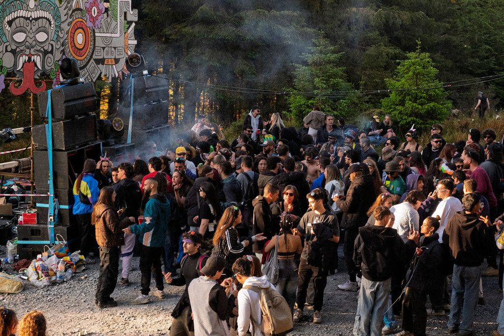 Crowd at a Primal Effect outdoor event at dusk