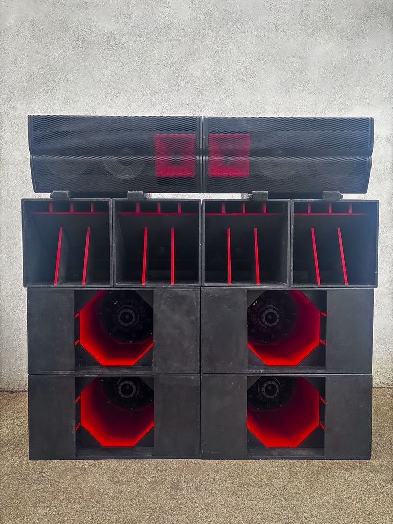 Custom-built Primal Effect speaker stack with red horn detailing