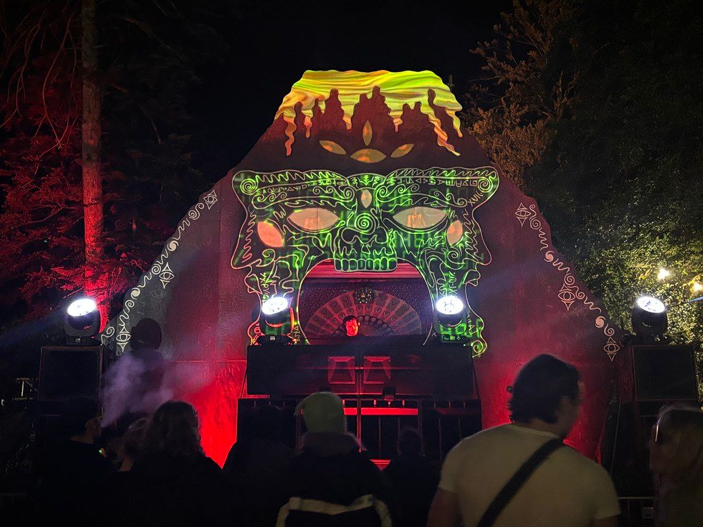 Volcano stage at night with green and red projection