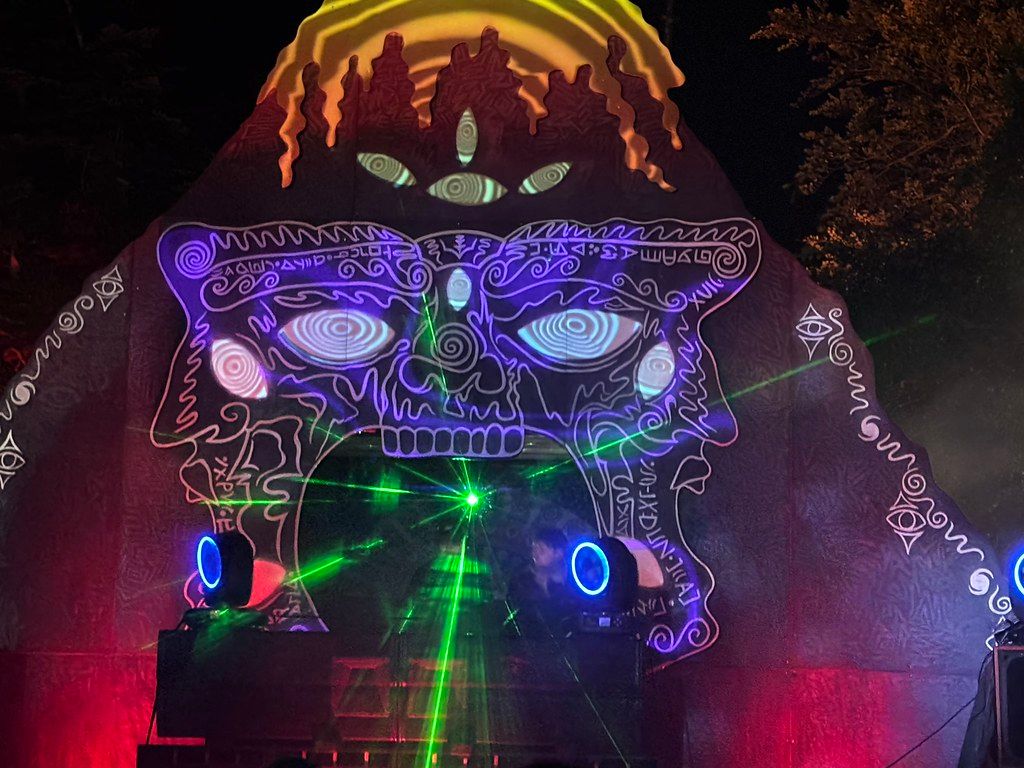 Close-up volcano stage with UV projection and lasers
